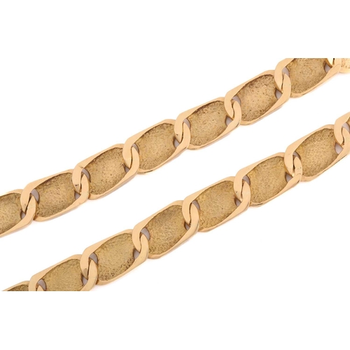 38 - A fancy curb link chain, panels part textured, finished with a figure-of-eight clasp, yellow metal m... 