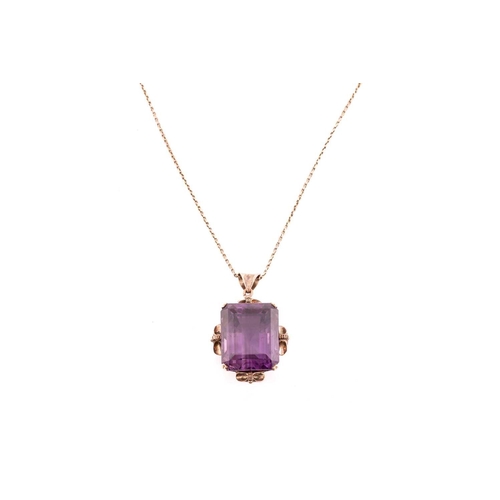 39 - A large amethyst pendant on chain, contains an octagonal step-cut amethyst of 19.6 x 15.9 x 14.2 mm,... 