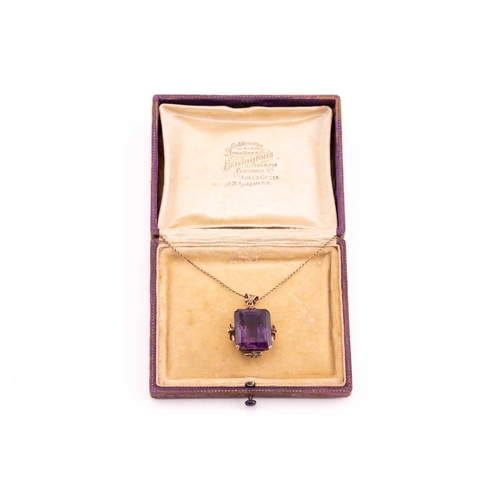 39 - A large amethyst pendant on chain, contains an octagonal step-cut amethyst of 19.6 x 15.9 x 14.2 mm,... 