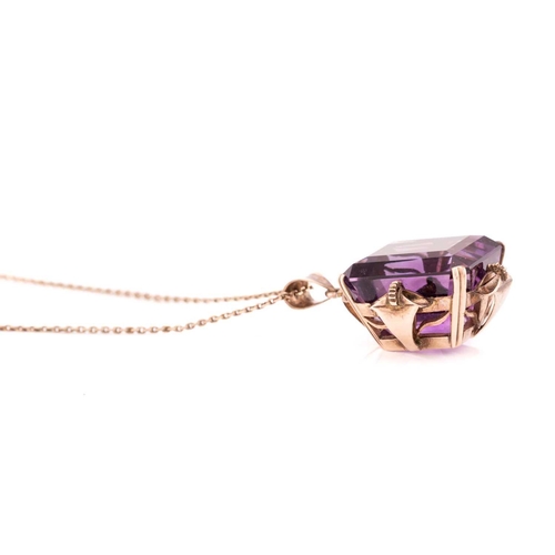 39 - A large amethyst pendant on chain, contains an octagonal step-cut amethyst of 19.6 x 15.9 x 14.2 mm,... 