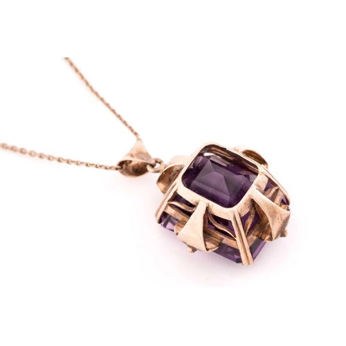 39 - A large amethyst pendant on chain, contains an octagonal step-cut amethyst of 19.6 x 15.9 x 14.2 mm,... 