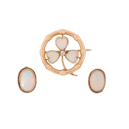 4 - A precious opal clover brooch and a pair of earrings; the brooch of clover design constructed by thr... 