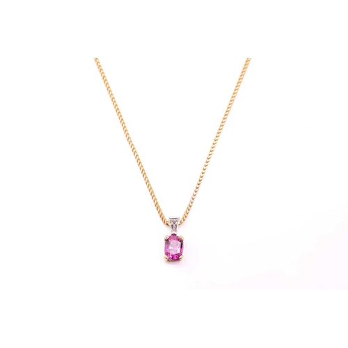 46 - A pink sapphire and diamond pendant and chain, the oval mixed cut pink sapphire, approximately 1.14c... 