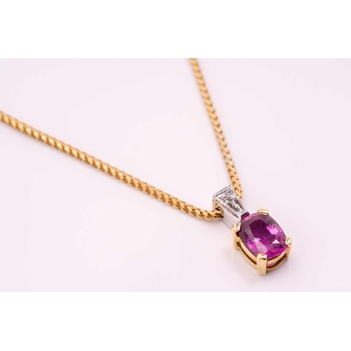 46 - A pink sapphire and diamond pendant and chain, the oval mixed cut pink sapphire, approximately 1.14c... 