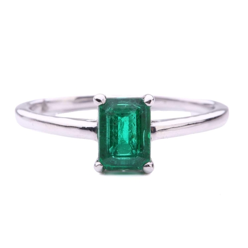 50 - An emerald solitaire ring, featuring an emerald-cut emerald with intense green body colour, approxim... 