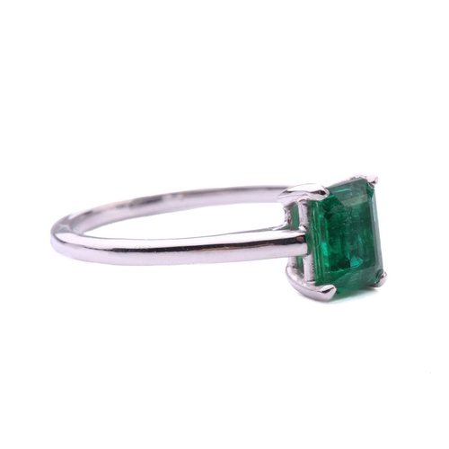 50 - An emerald solitaire ring, featuring an emerald-cut emerald with intense green body colour, approxim... 