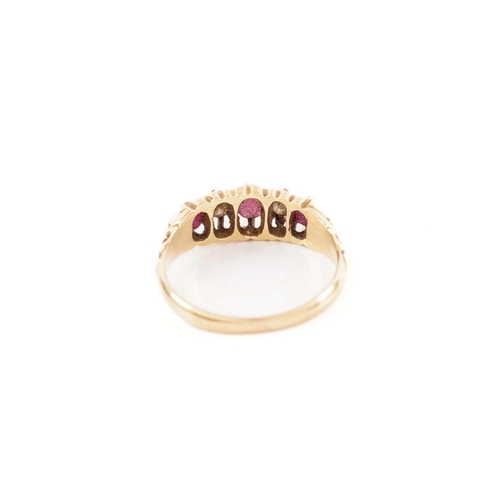 59 - A five-stone half-hoop ring set with rubies and diamonds, comprising three circular-cut rubies flank... 