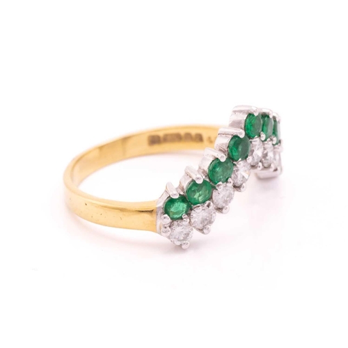 63 - An emerald and diamond ring in 18ct gold, of chevron design, comprising a row of nine brilliant-cut ... 