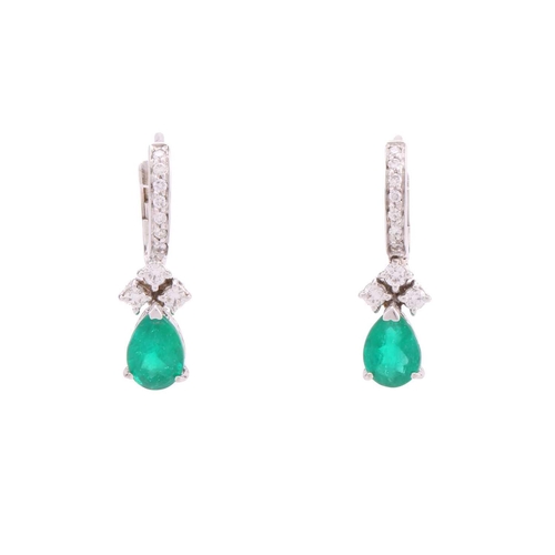 67 - A pair of emerald and diamond earrings, each containing a pear-shaped emerald of intense green body ... 