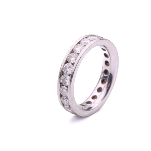 79 - A diamond eternity ring in platinum, containing twenty-one round brilliant-cut diamonds of 3.0 mm, c... 