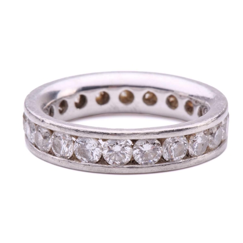 79 - A diamond eternity ring in platinum, containing twenty-one round brilliant-cut diamonds of 3.0 mm, c... 