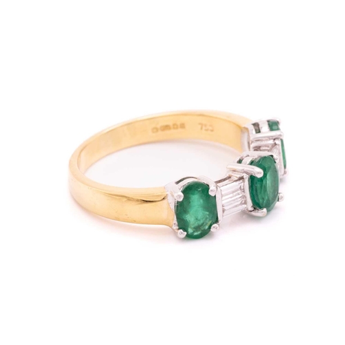 8 - An emerald and diamond dress ring in 18ct bi-coloured gold, comprising three oval-cut emeralds in cl... 