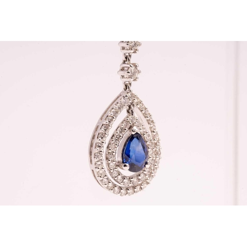 84 - A pair of sapphire and diamond drop earrings, each with a pear cut sapphire and an oval mixed cut sa... 