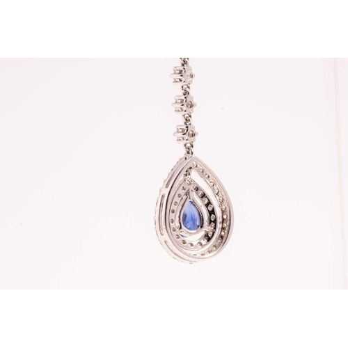 84 - A pair of sapphire and diamond drop earrings, each with a pear cut sapphire and an oval mixed cut sa... 