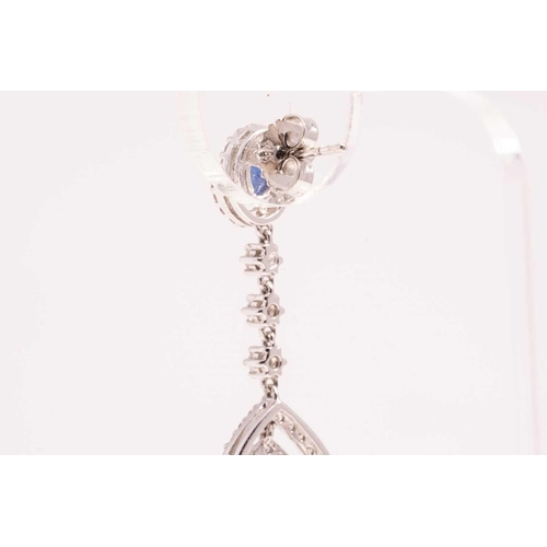 84 - A pair of sapphire and diamond drop earrings, each with a pear cut sapphire and an oval mixed cut sa... 