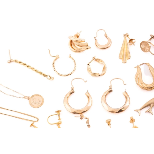 93 - A large collection of earrings, necklaces and a brooch. Comprising of eight matching yellow metal ea... 