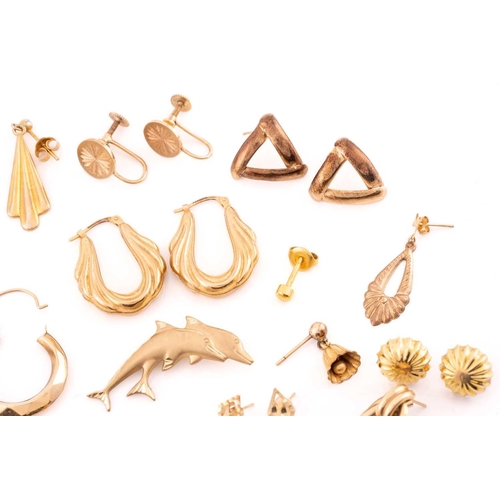 93 - A large collection of earrings, necklaces and a brooch. Comprising of eight matching yellow metal ea... 