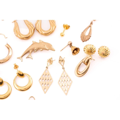 93 - A large collection of earrings, necklaces and a brooch. Comprising of eight matching yellow metal ea... 