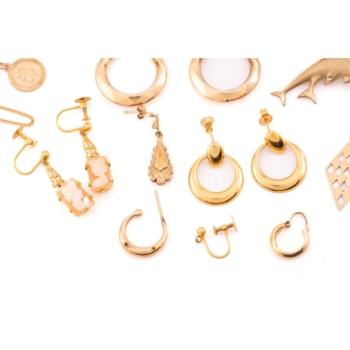 93 - A large collection of earrings, necklaces and a brooch. Comprising of eight matching yellow metal ea... 