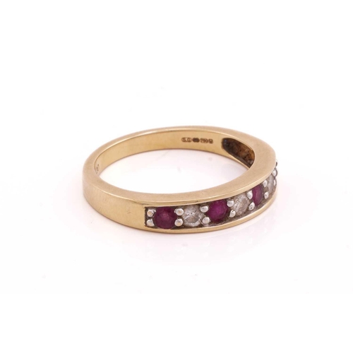 95 - A ruby and diamond seven stone half hoop eternity ring; comprising three round brilliant cut diamond... 