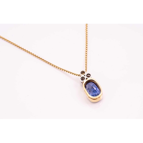 99 - A sapphire and diamond pendant on chain, the rub over set oval mixed cut sapphire, approximately 3.5... 