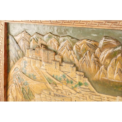 100 - A relief carved wood panel of the Potala Palace, Lhasa, Tibet, inscribed as being carved during the ... 