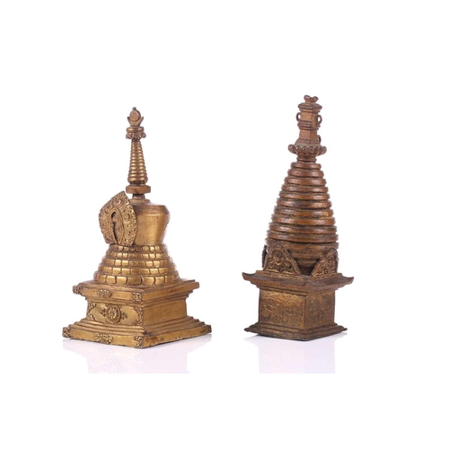 101 - A bronze stupa, possibly of Svayambhunath, Kathmandu, 17cm; and a gilt bronze Nepalese consecrated s... 