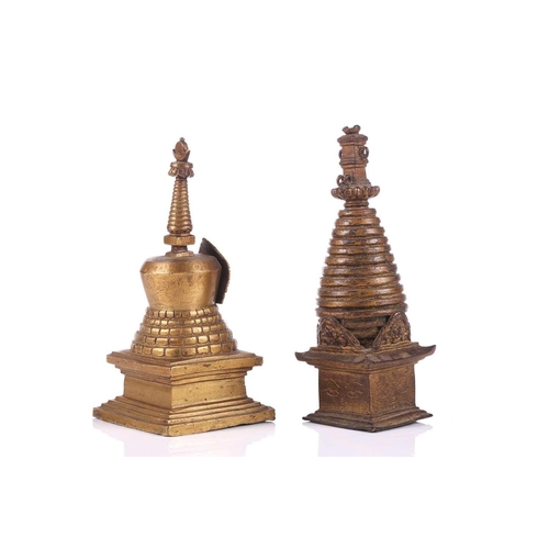 101 - A bronze stupa, possibly of Svayambhunath, Kathmandu, 17cm; and a gilt bronze Nepalese consecrated s... 