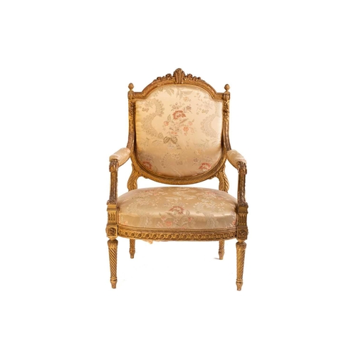 102 - In the manner of George Jacob; a Louis XVI style finely carved wood and gilt gesso fauteuil, late 19... 