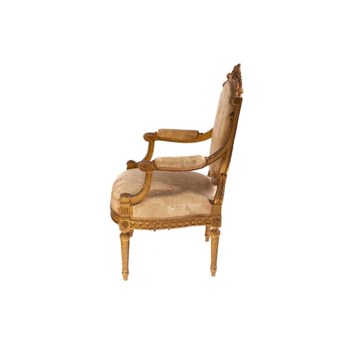 102 - In the manner of George Jacob; a Louis XVI style finely carved wood and gilt gesso fauteuil, late 19... 