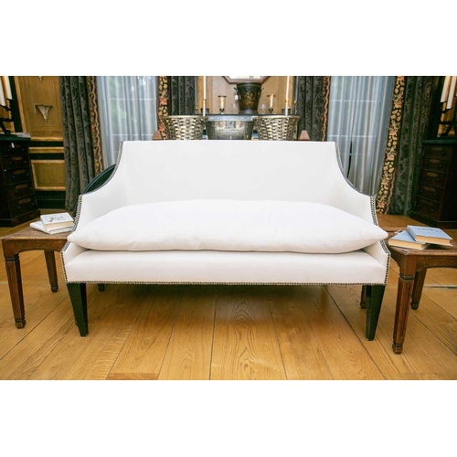 104 - A George III style two-seat sofa with swept arms and square back, with close nail detail raised on e... 