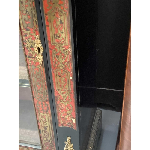 106 - A Victorian ebonized and red Boule marquetry inlaid single door pier cabinet with gilt metal caryati... 