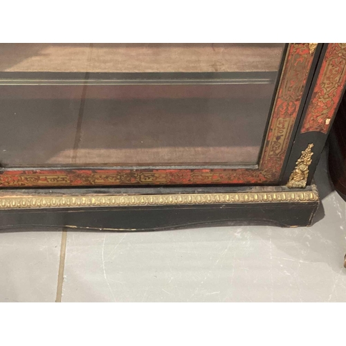 106 - A Victorian ebonized and red Boule marquetry inlaid single door pier cabinet with gilt metal caryati... 