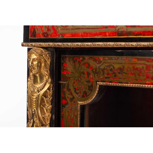 106 - A Victorian ebonized and red Boule marquetry inlaid single door pier cabinet with gilt metal caryati... 