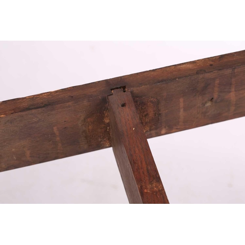 108 - A French rustic oak farmhouse table, 19th century, with cleated scrubbed plank top, supported by sub... 