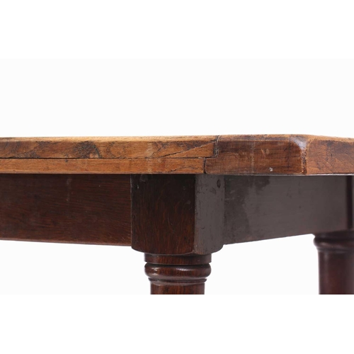 108 - A French rustic oak farmhouse table, 19th century, with cleated scrubbed plank top, supported by sub... 