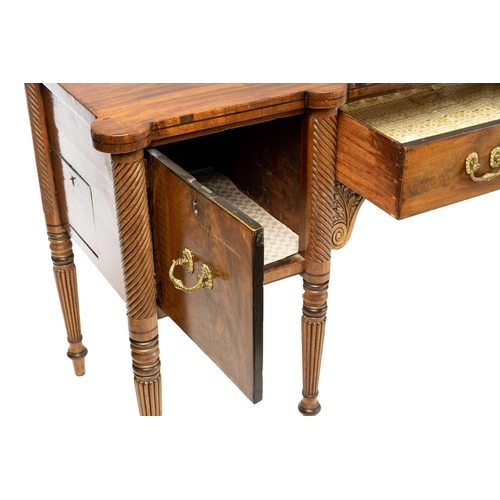 117 - A Regency mahogany sideboard, the rectangular top with rounded corners and ebony strung edge over a ... 