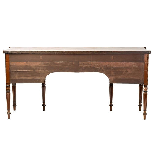 117 - A Regency mahogany sideboard, the rectangular top with rounded corners and ebony strung edge over a ... 