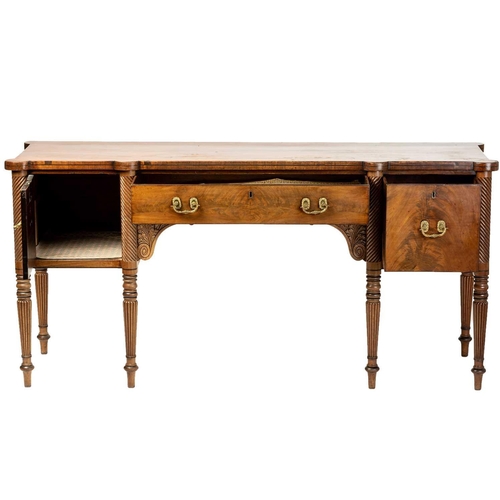 117 - A Regency mahogany sideboard, the rectangular top with rounded corners and ebony strung edge over a ... 