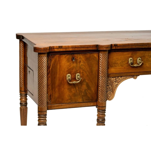 117 - A Regency mahogany sideboard, the rectangular top with rounded corners and ebony strung edge over a ... 