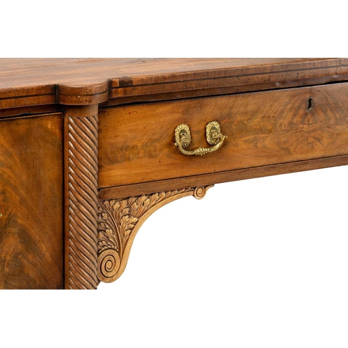 117 - A Regency mahogany sideboard, the rectangular top with rounded corners and ebony strung edge over a ... 