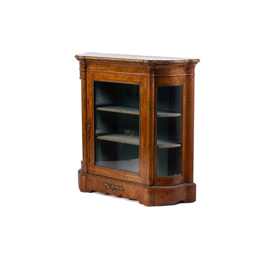 119 - A Victorian figured walnut credenza with a tulipwood banded figured top above a central glazed door ... 