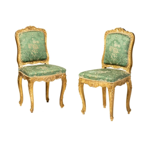 122 - A pair Louis XV style carved wood and gilt gesso salon chairs, 19th century, with shaped cresting ra... 