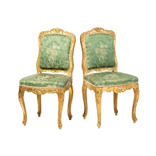 122 - A pair Louis XV style carved wood and gilt gesso salon chairs, 19th century, with shaped cresting ra... 