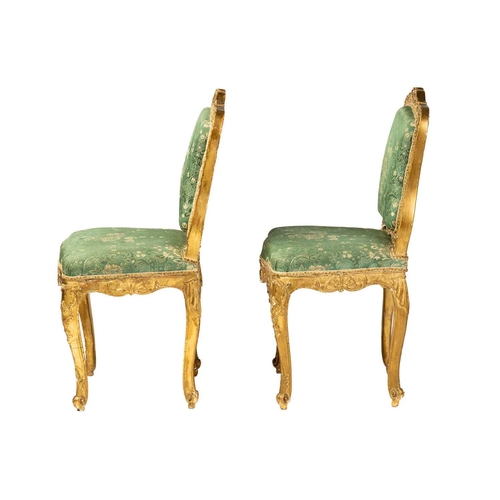 122 - A pair Louis XV style carved wood and gilt gesso salon chairs, 19th century, with shaped cresting ra... 