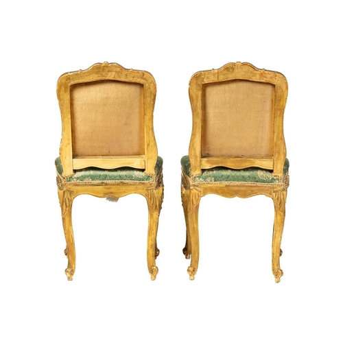 122 - A pair Louis XV style carved wood and gilt gesso salon chairs, 19th century, with shaped cresting ra... 