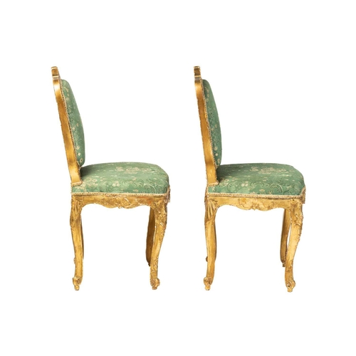 122 - A pair Louis XV style carved wood and gilt gesso salon chairs, 19th century, with shaped cresting ra... 