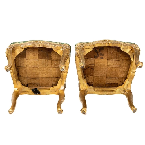 122 - A pair Louis XV style carved wood and gilt gesso salon chairs, 19th century, with shaped cresting ra... 