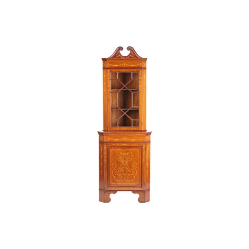 123 - An Edwardian mahogany and Neo-Classical marquetry inlaid freestanding corner display cabinet, in the... 