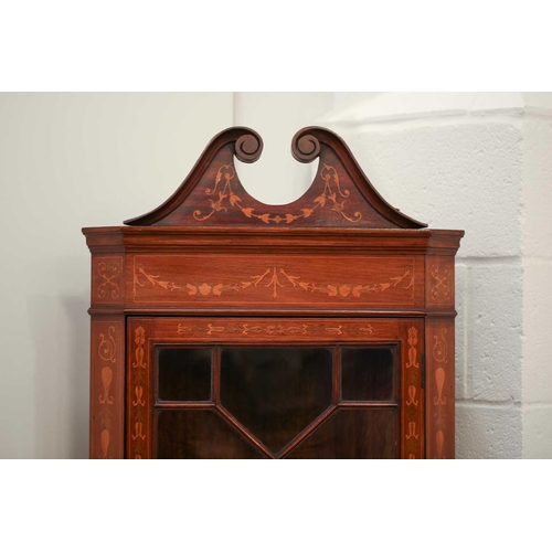 123 - An Edwardian mahogany and Neo-Classical marquetry inlaid freestanding corner display cabinet, in the... 